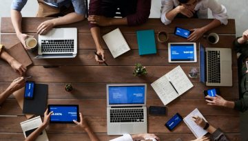 members of a project team working together around a table