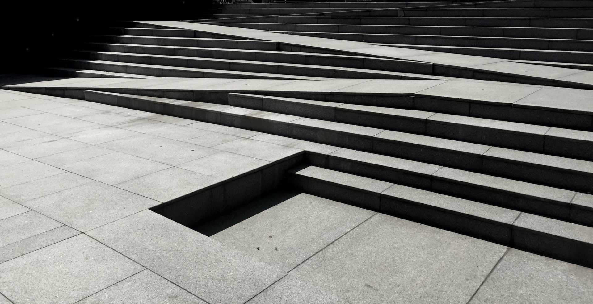 This stair design has targeted accessibility by incorporating a ramp within the steps.